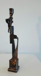 Figure with crossed legs